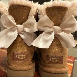 Tan Ugg boots with bow on back